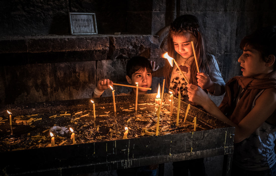 Lighting candles, Armenia